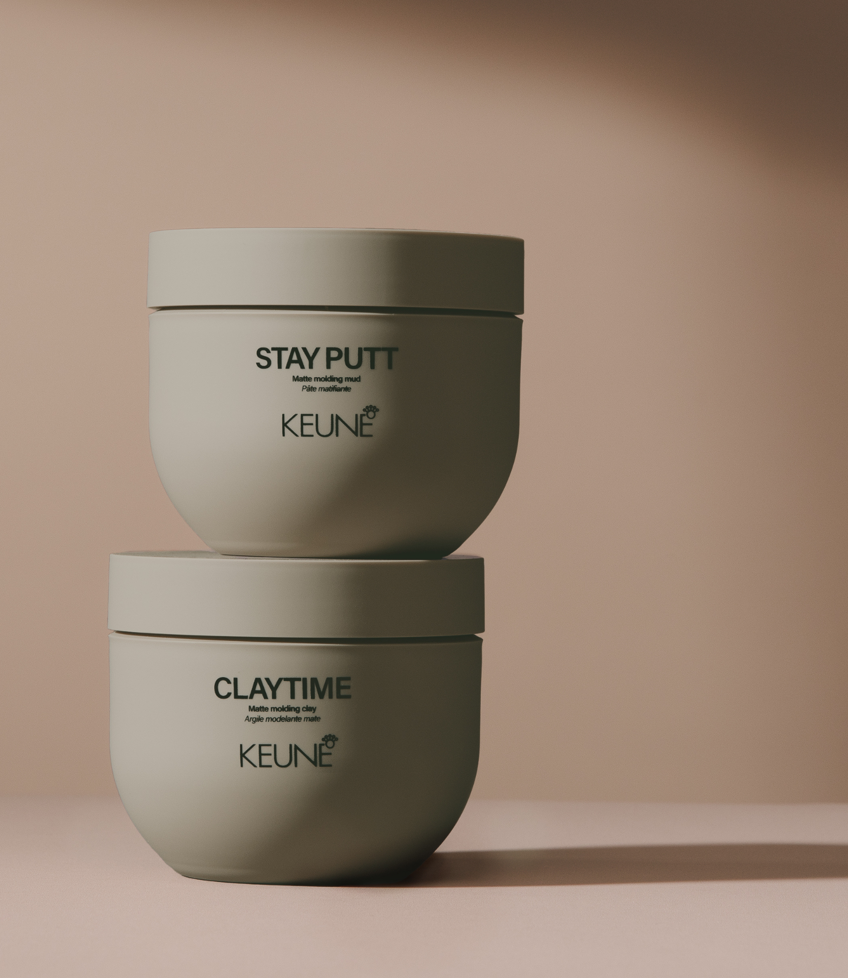 Create the perfect hairstyle with Keune Stay Putt Matte Molding Mud, offering flexibility and a matte finish.